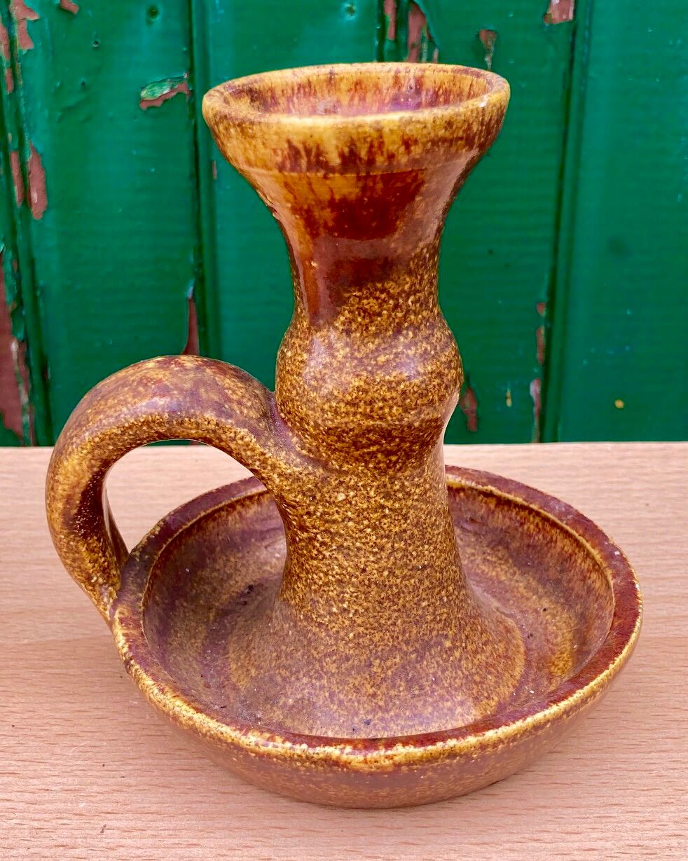 Candle holder in old earthenware signed by the 2 glued aa of the Accolay factory