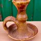 Candle holder in old earthenware signed by the 2 glued aa of the Accolay factory
