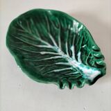 Vintage green slipware bowl in the shape of a cabbage leaf.