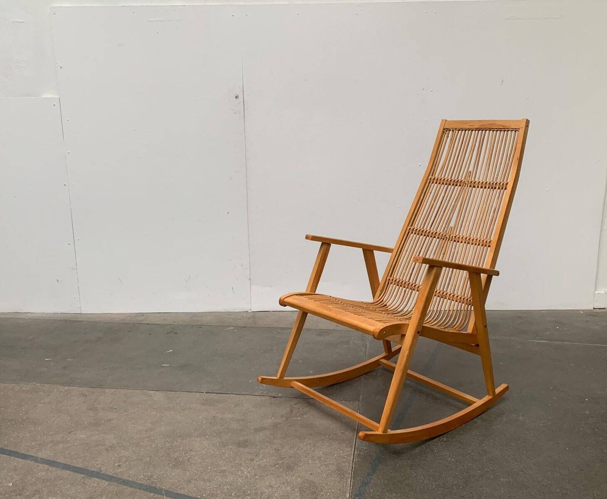Mid-century German rattan rocking chair from Deutschen Werkstätten Hellerau, 1960s.