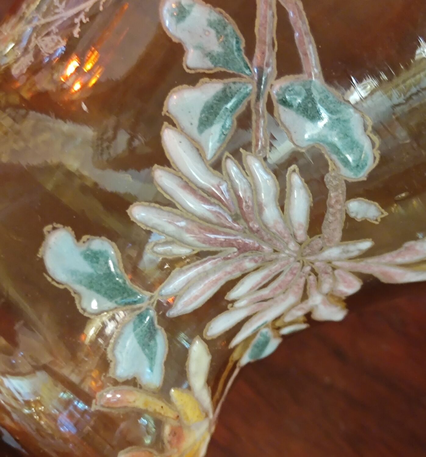 Old vase with enamelled floral decoration