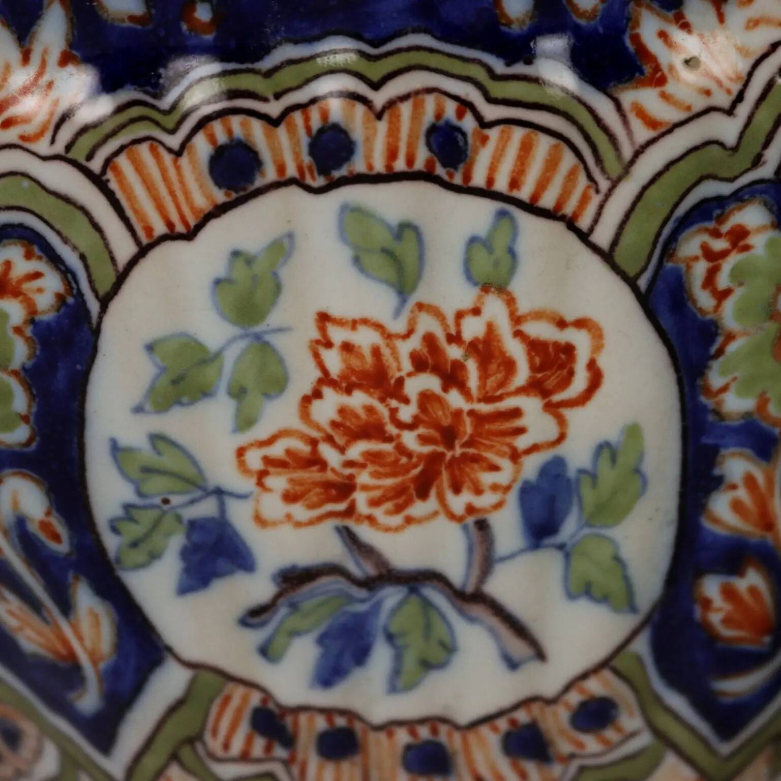 Ancient vase fully decorated with ceramic plants, 20th century.