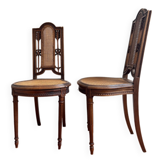 Pair of Louis XVI caned chairs carved gilded wood arrows knots late 19th century