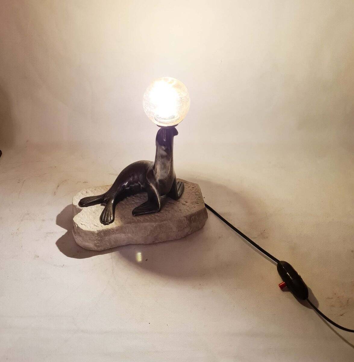 Art Deco "sea lion" lamp in silver-plated bronze