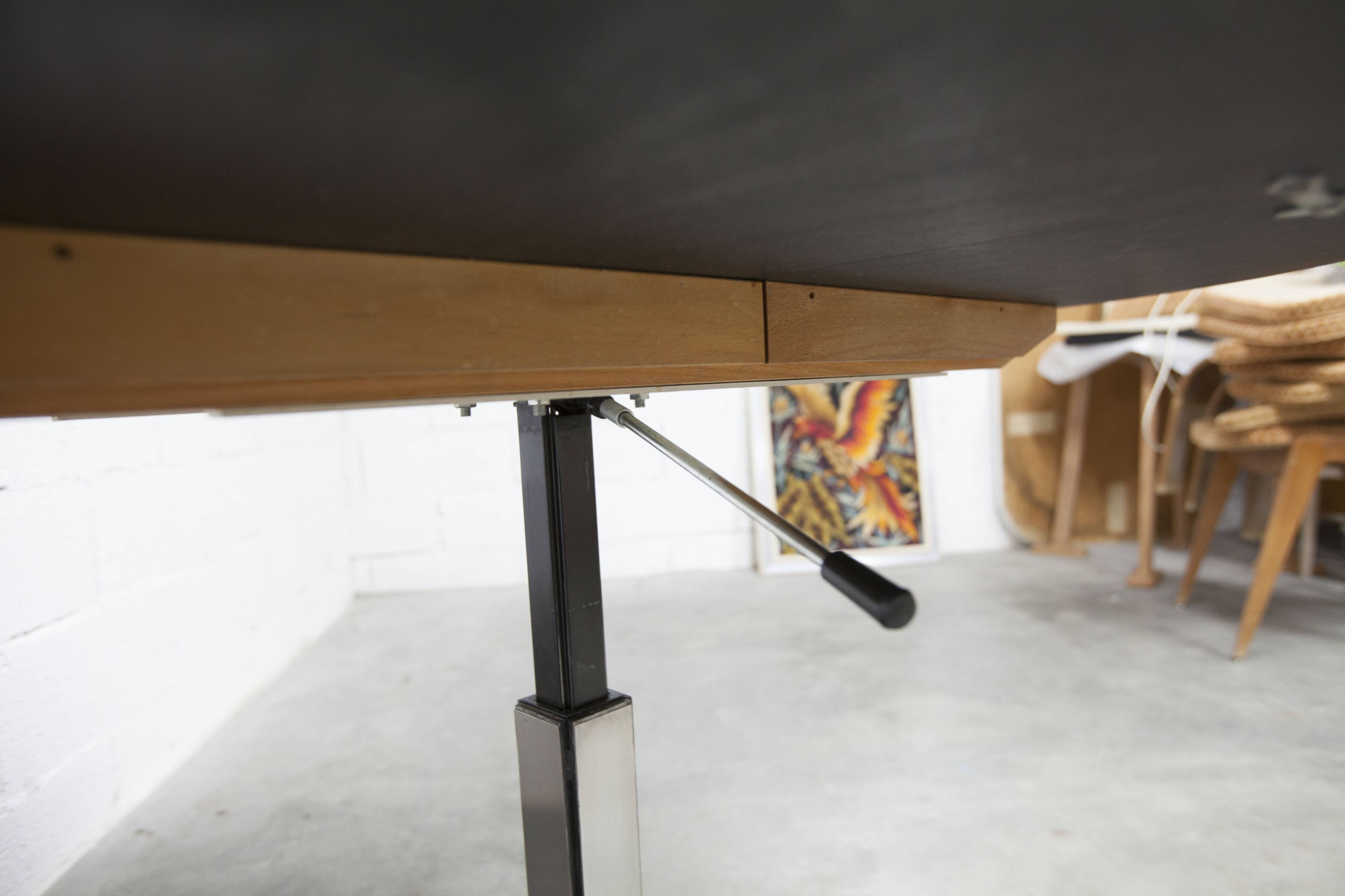 Round table rises and lowers Osvaldo Borsani black and chrome with extension