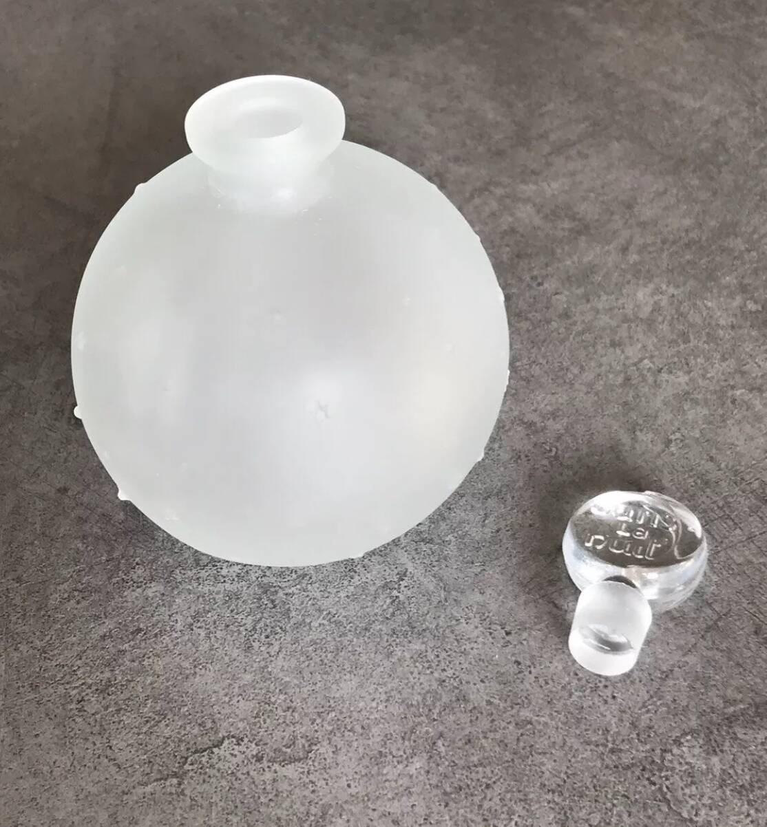 Lalique bottle in the night, frosted glass, ball shape