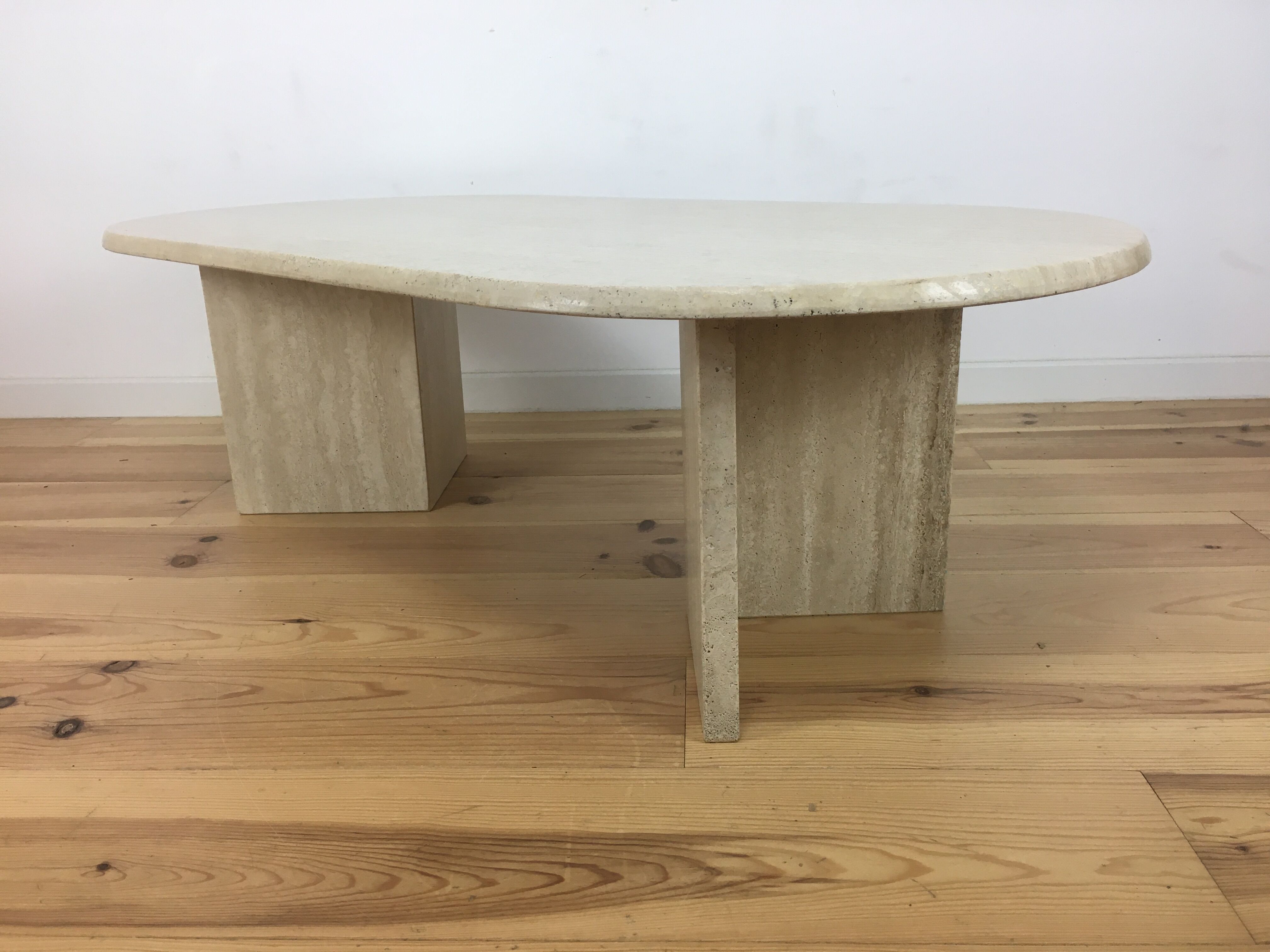 Oval coffee table in travertine