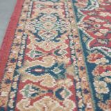 Vintage oriental rug with predominantly red, cream, and beige colors, measuring 168x120 cm