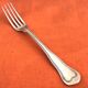 Antique dessert fork by silversmith Christofle, Chinon model collection.