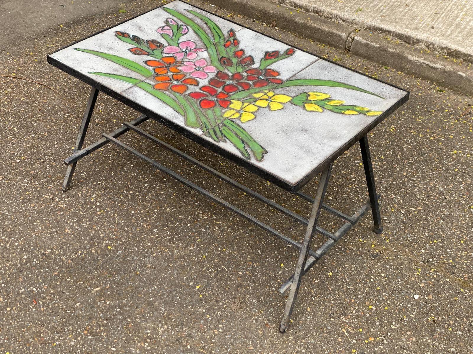 Vintage rectangular coffee table with ceramic inlaid flowers and steel.