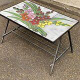 Vintage rectangular coffee table with ceramic inlaid flowers and steel.