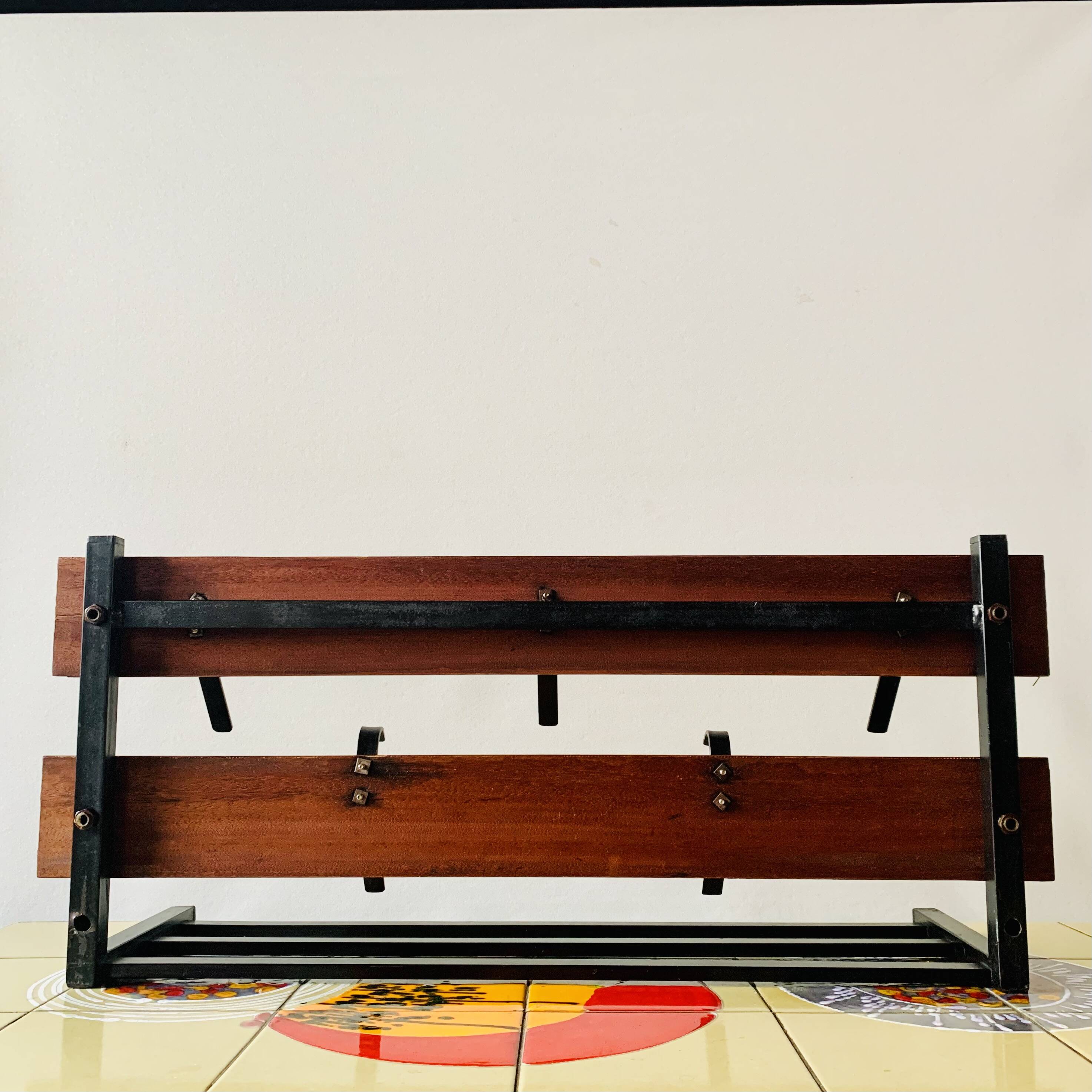 Vintage wall-mounted coat rack in wood and black metal
