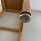 Vintage stool from the 60s with aged leather seat