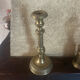 Large antique brass candlestick with floral decoration.