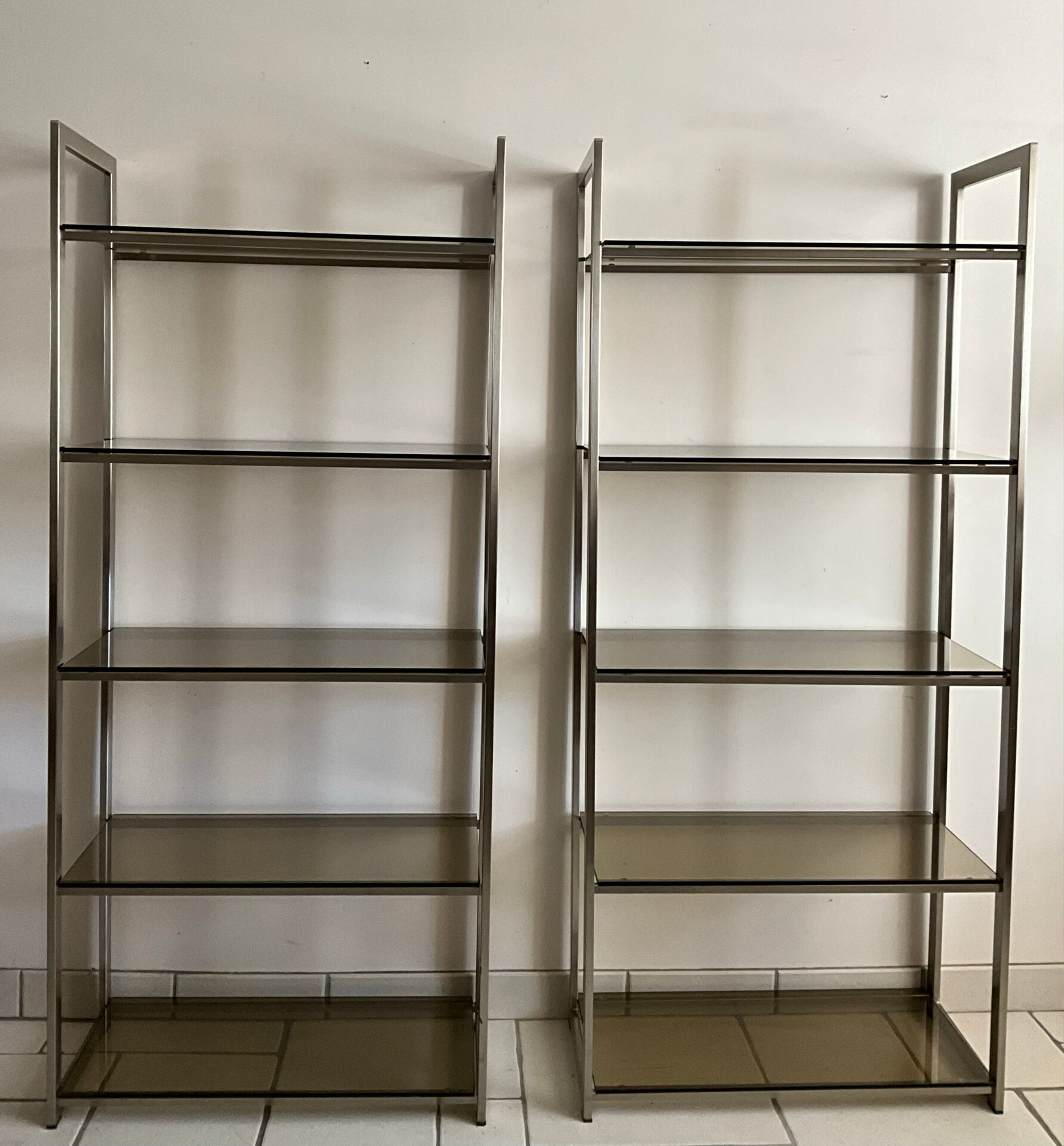 Pair of Artelano bookshelves in anodised metal and smoked glass, 1970s.
