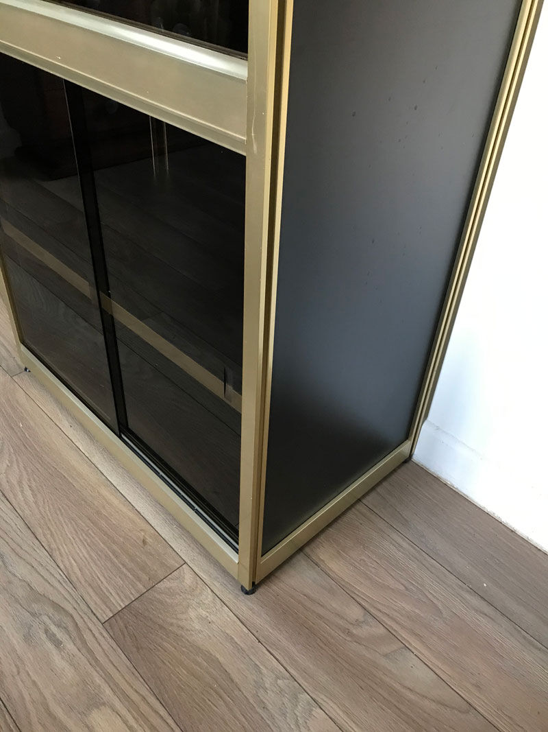 Shelves of black and gold windows