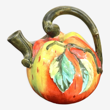 Old pitcher in the shape of an apple