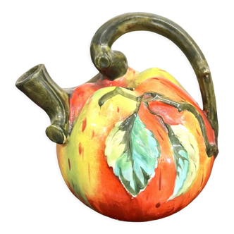 Old pitcher in the shape of an apple