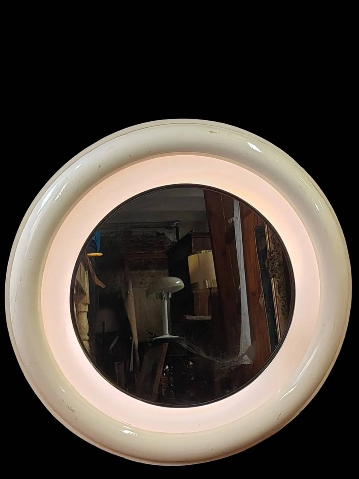 1970s mirror with integrated lighting, futuristic design, vintage wood.