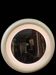 1970s mirror with integrated lighting, futuristic design, vintage wood.