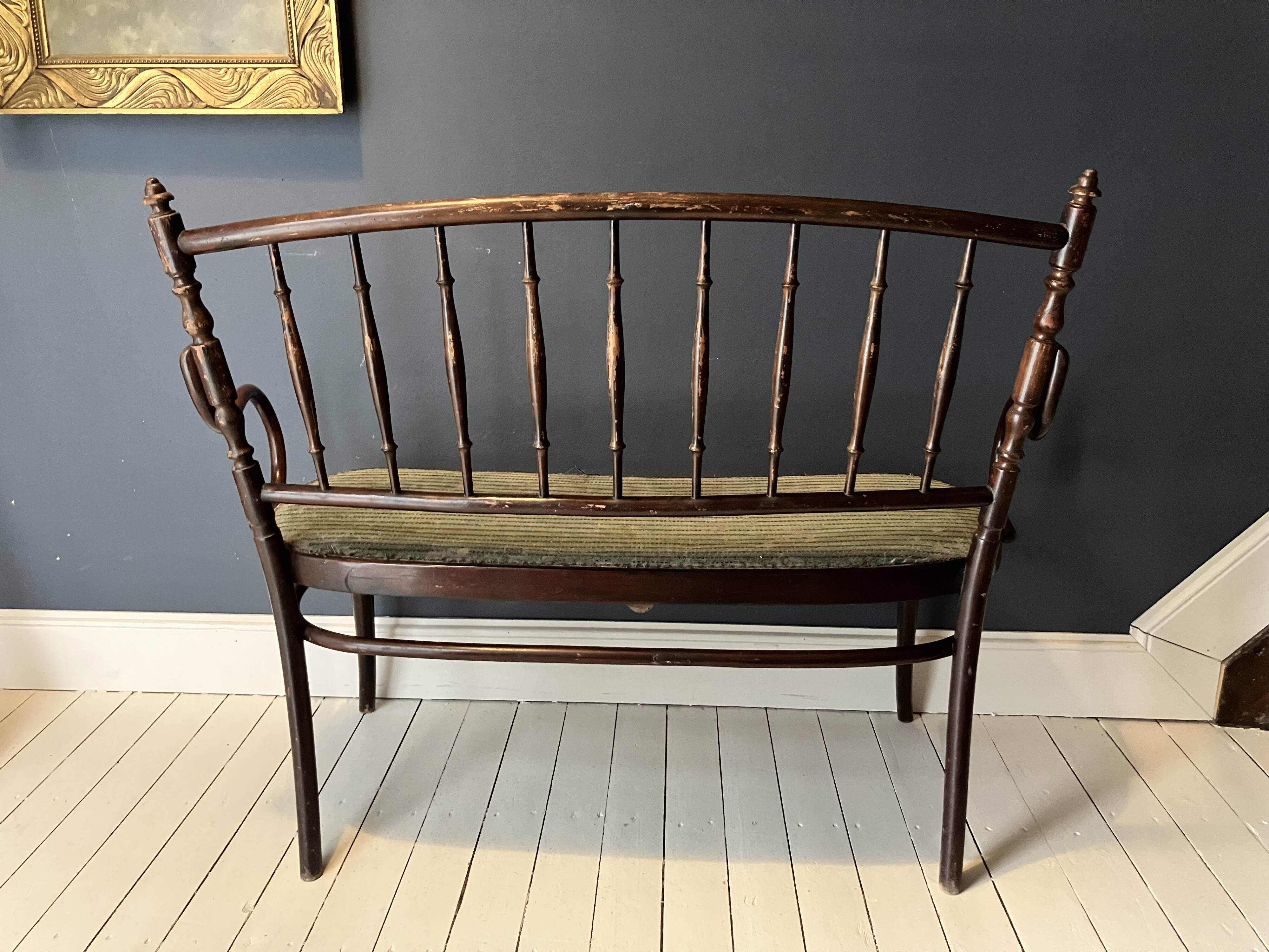 Thonet-branded bistro-style bench in turned wood, velvet and caning