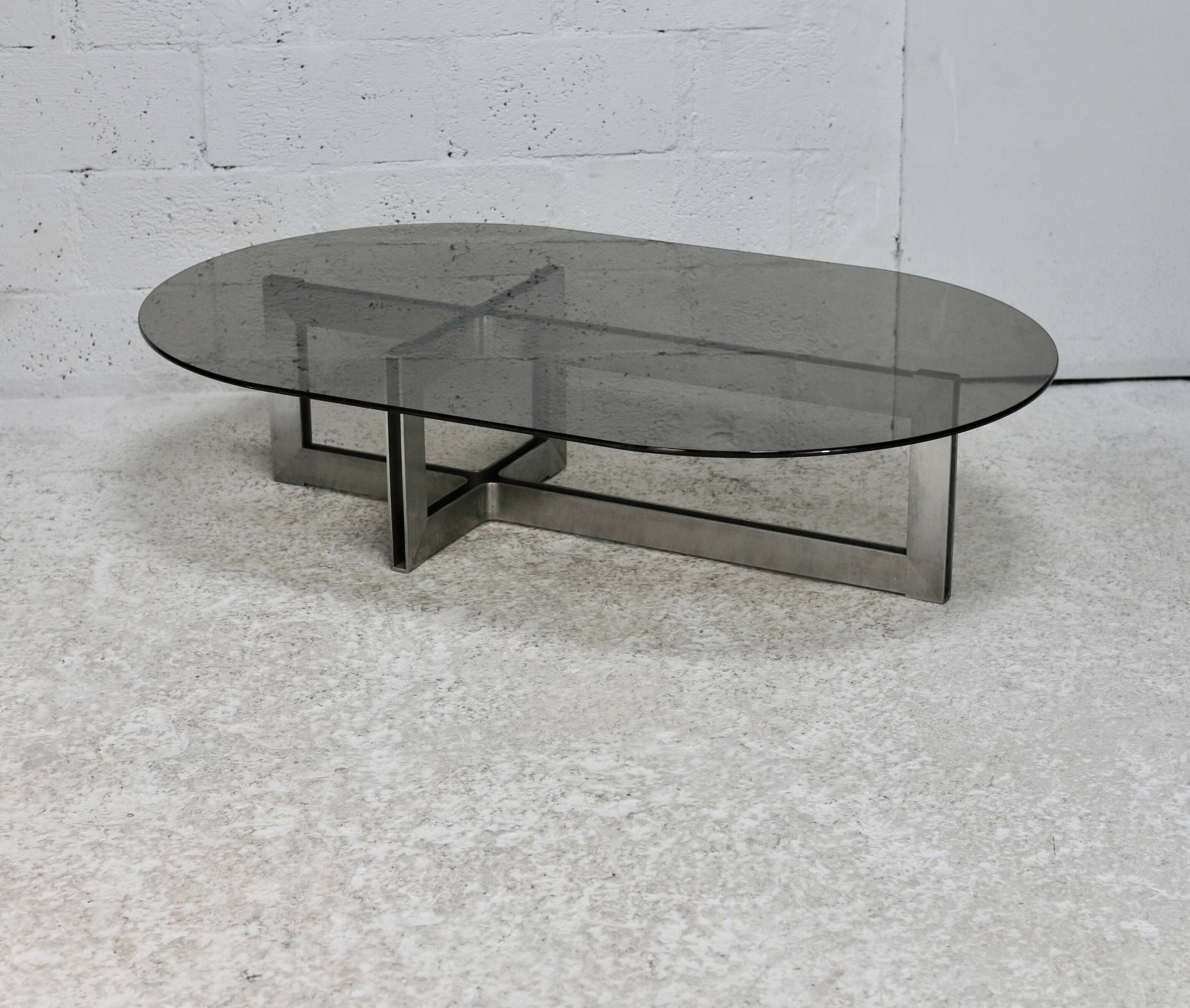 Coffee table with steel base and smoked glass slab. Circa 197
