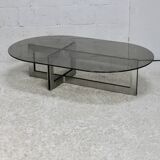 Coffee table with steel base and smoked glass slab. Circa 197