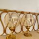 2 bedside lamps with round amber glass globes and gold metal.