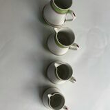 Series of 4 small pitchers.