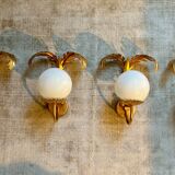 Pair of palm leaf wall lights in Hollywood Regency style with opaque globes by Hans Kögl, Germany, 1970s.