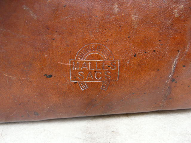 Old monogrammed leather travel suitcase and barony crown