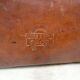 Old monogrammed leather travel suitcase and barony crown