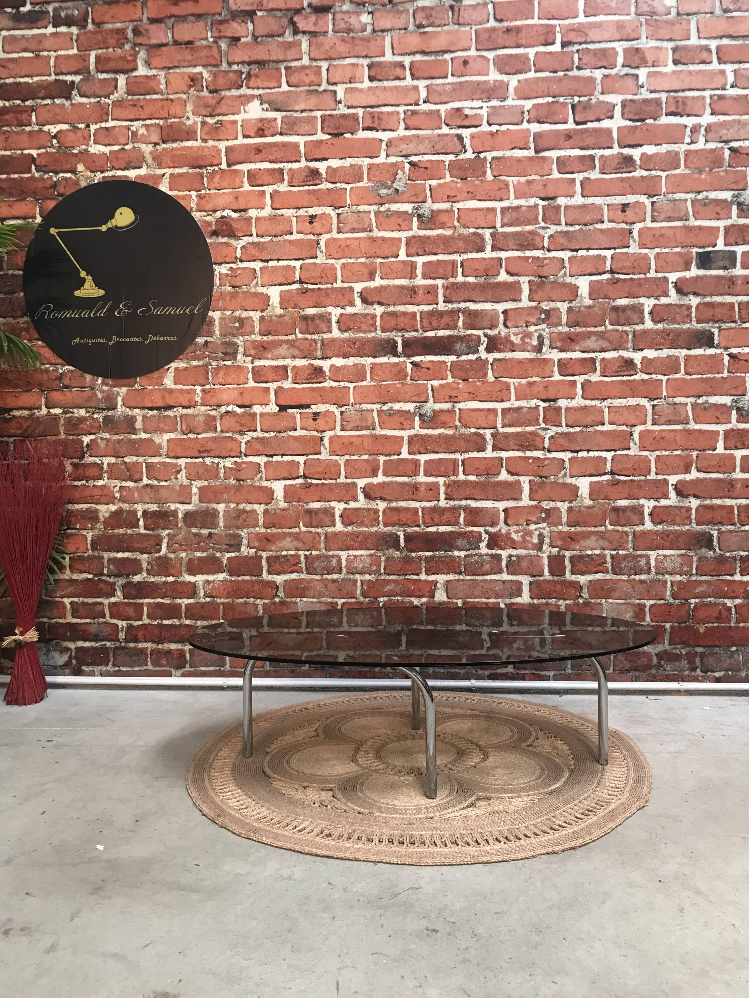 Vintage 70's oval coffee table in glass and chrome