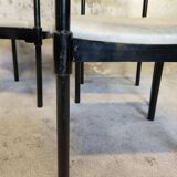 Set of six black lacquered wooden chairs.