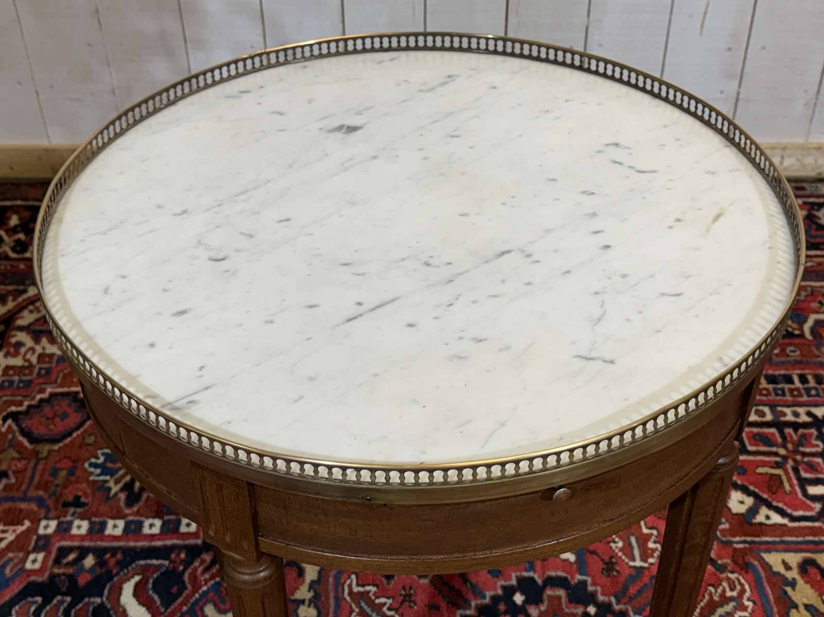 Louis XVI style bouillotte table from the 1960s in mahogany with a marble top.