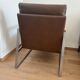 A pair genuine leather armchairs.