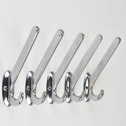 Up to 5 large Art Deco Bauhaus wall hooks in nickel and brass, Vienna, 1930s.