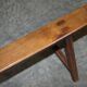 Pair of antique Victorian trestle benches in fruitwood.