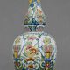 Large earthenware vase with a baluster body and elongated neck, richly decorated.