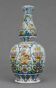 Large earthenware vase with a baluster body and elongated neck, richly decorated.
