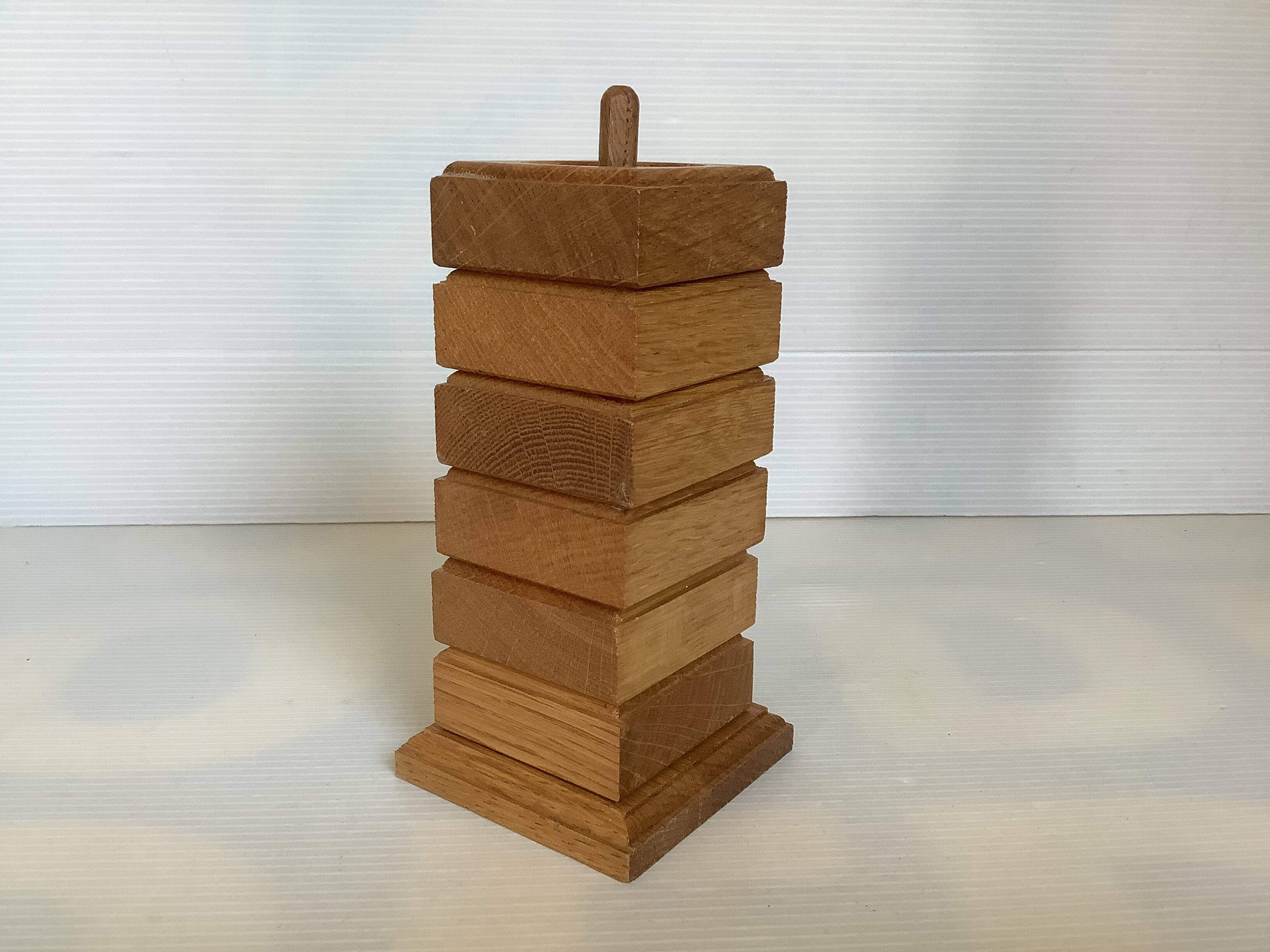 Six wooden egg cups and their Scandinavian style support