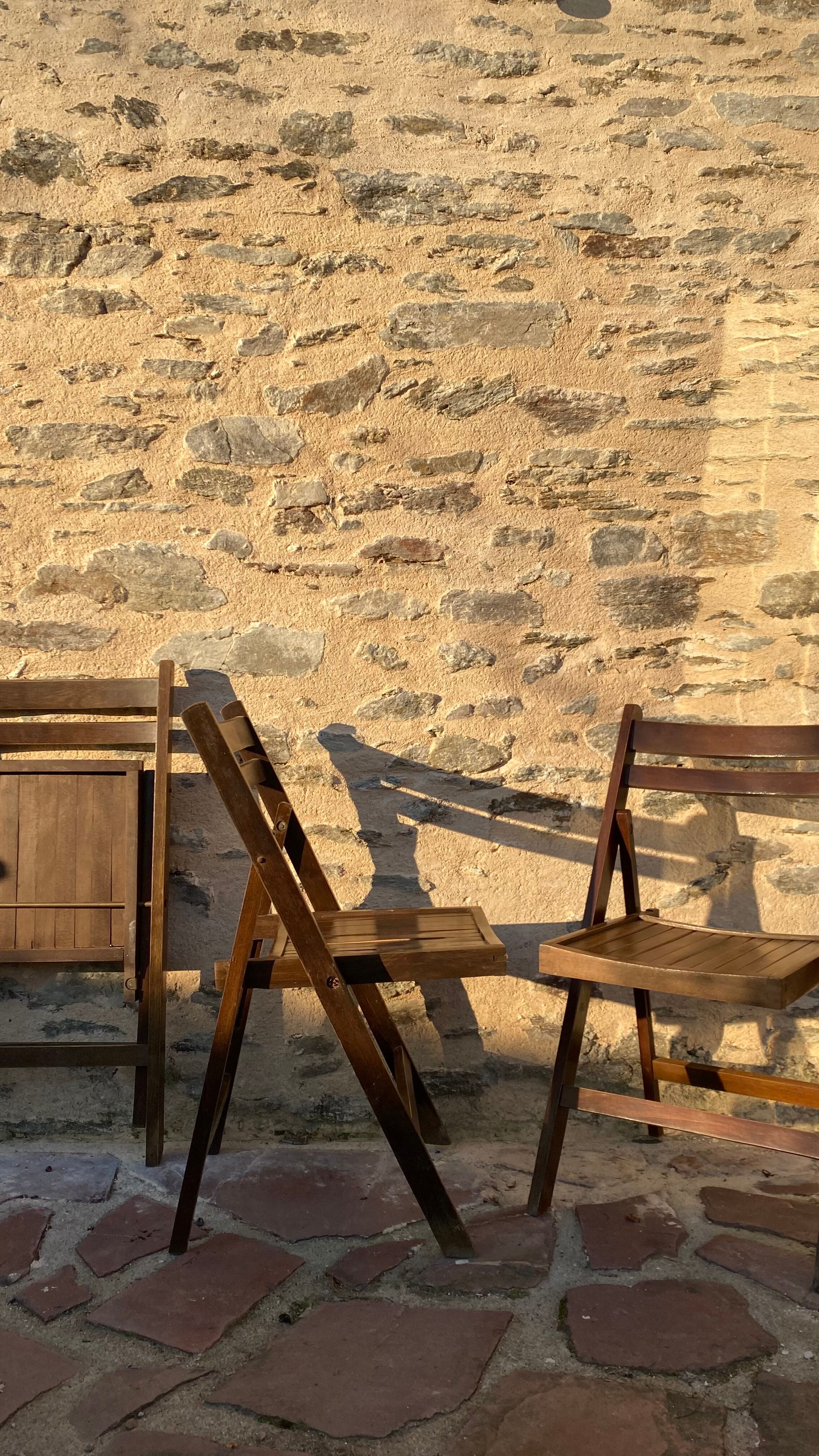 Three wooden folding chairs