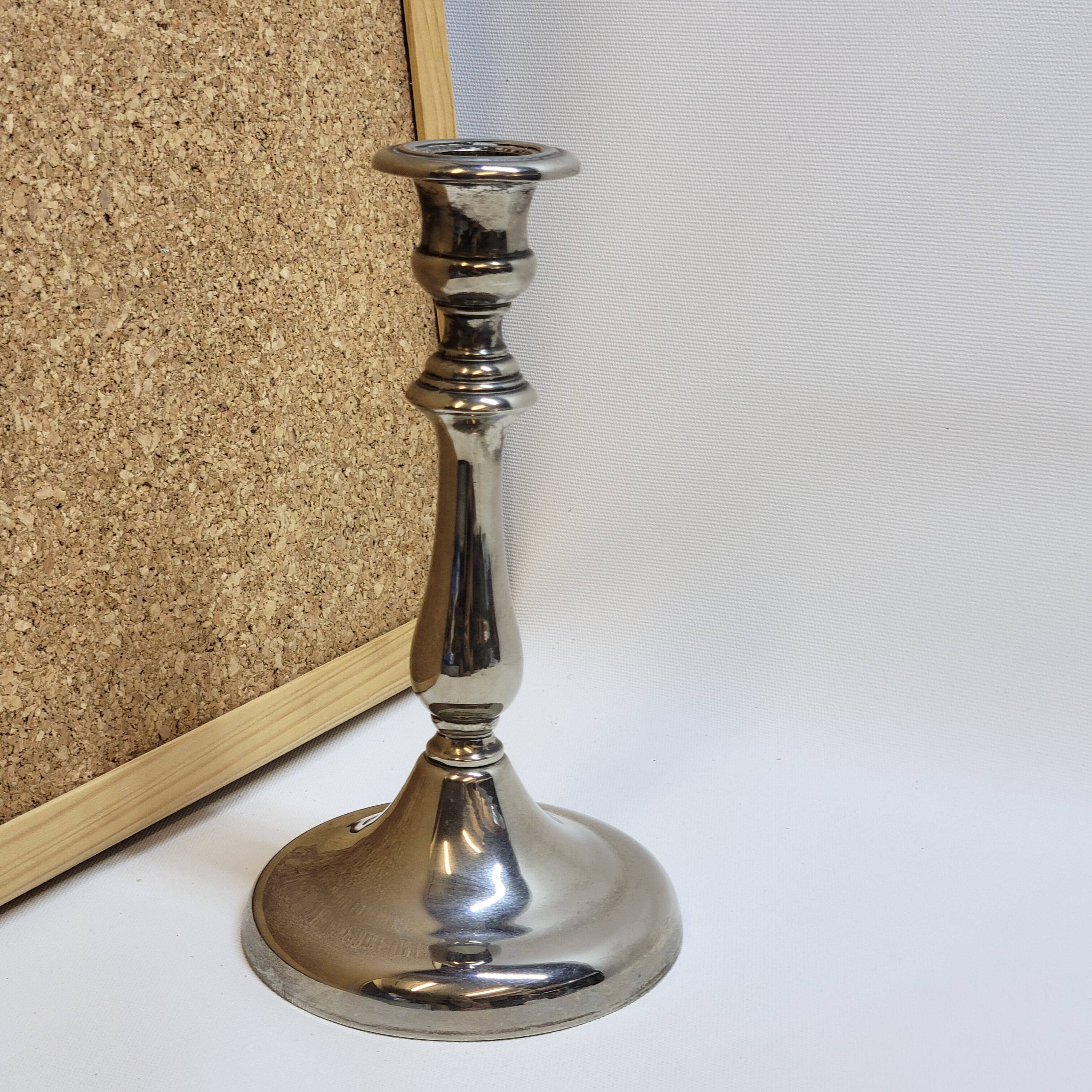 Old candle holder in silver metal