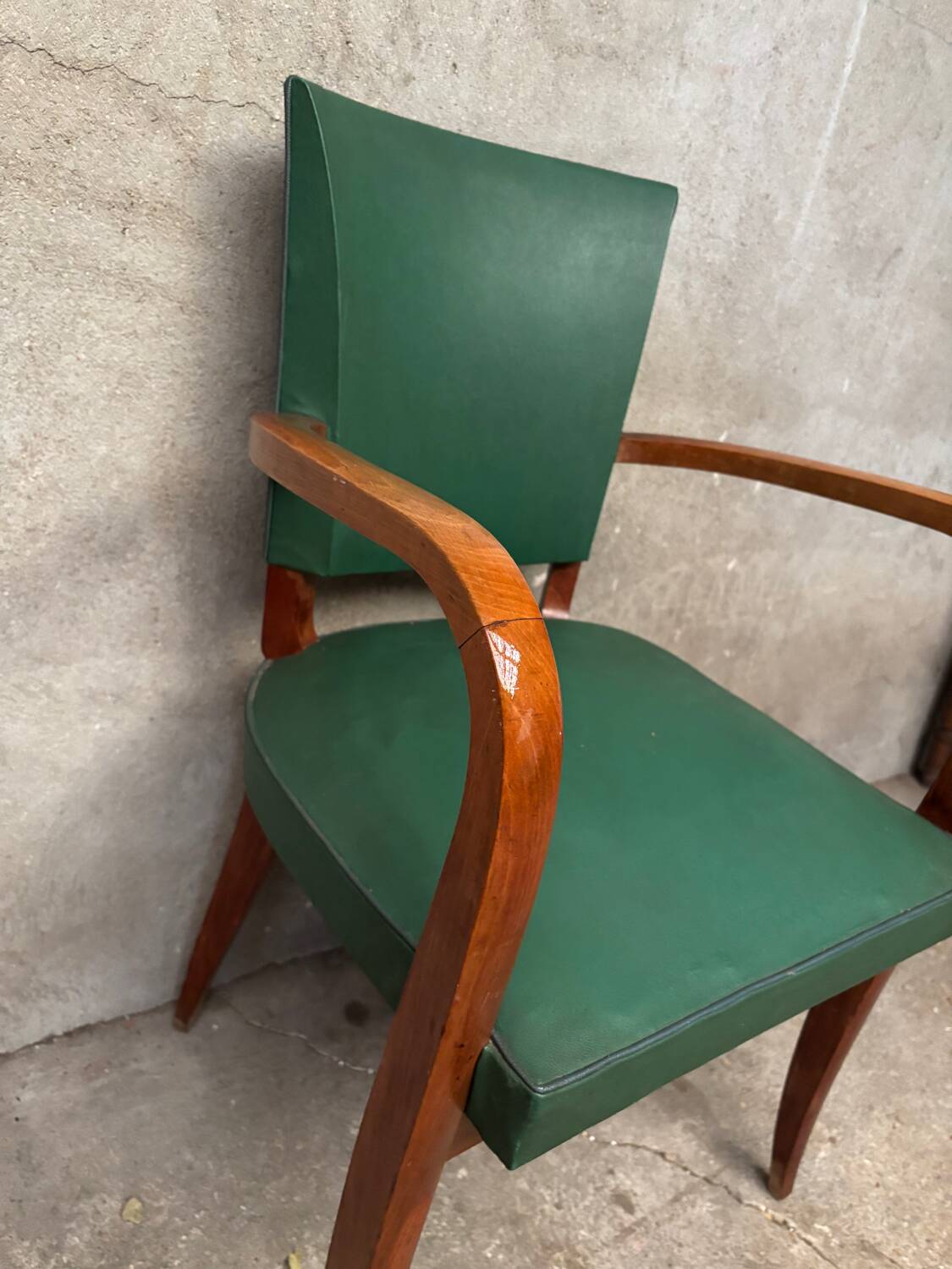 Green faux leather bridge chair