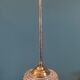 Chandelier entry support gilded metal patinated globe molded glass