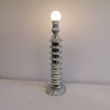 Table lamp made of transparent crystal glass and silver colored spacers.