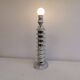 Table lamp made of transparent crystal glass and silver colored spacers.