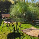 Garden table and wrought iron chair