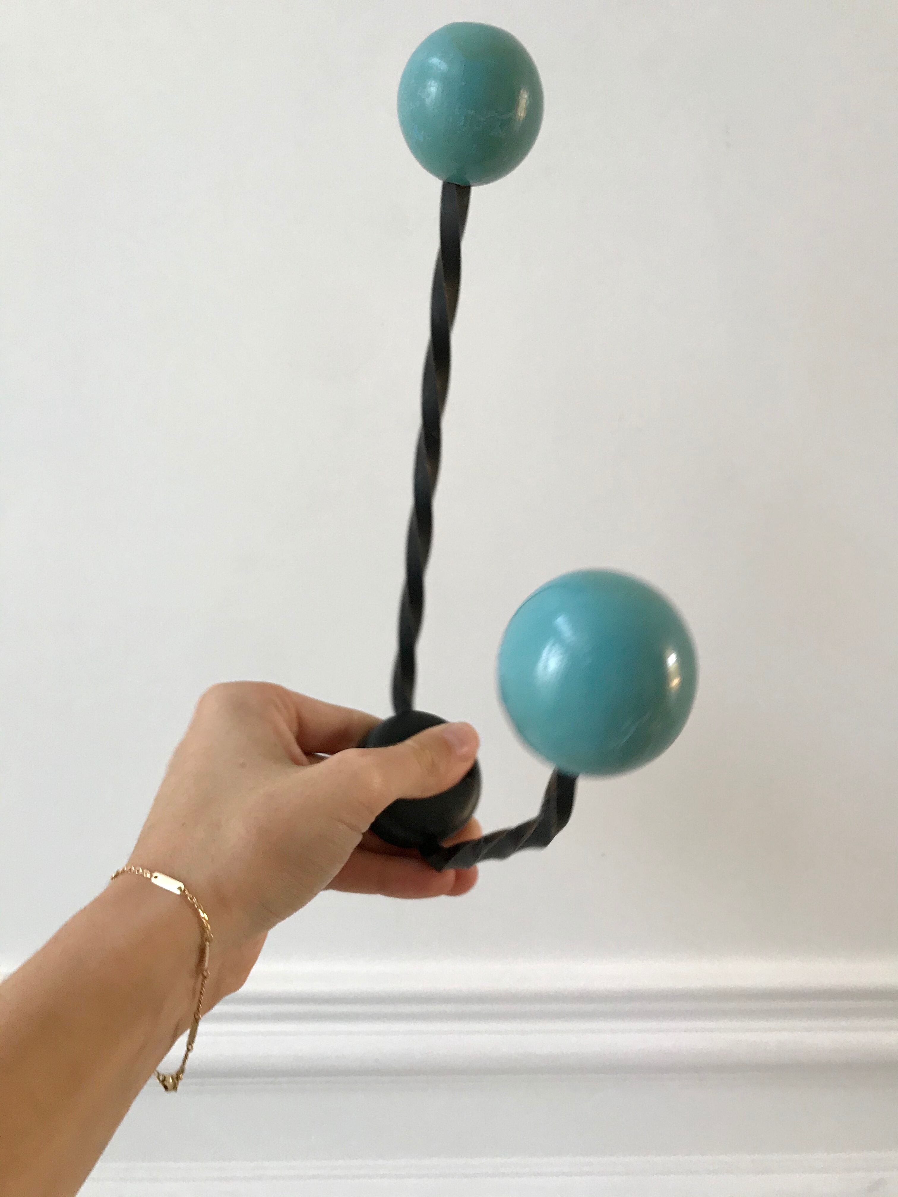Duo of hooks balls in blue wood and black iron 60s