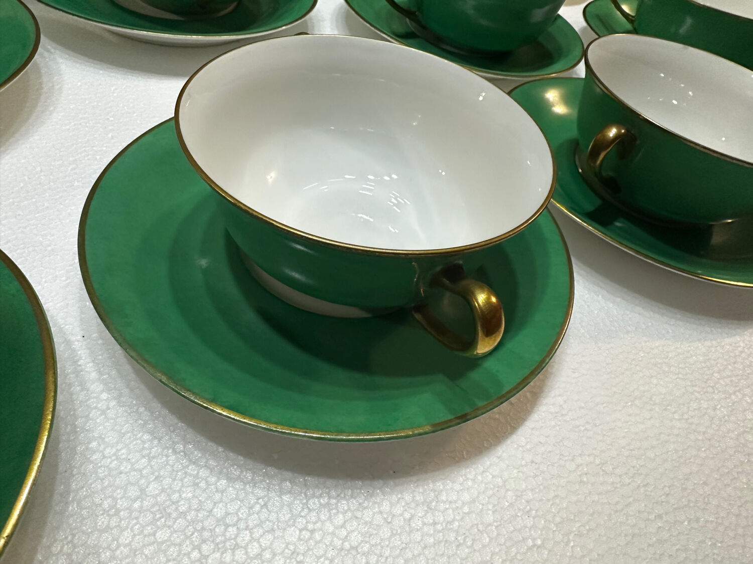 Service 14 cup and saucer in Art Deco Emerald Green and Gold.